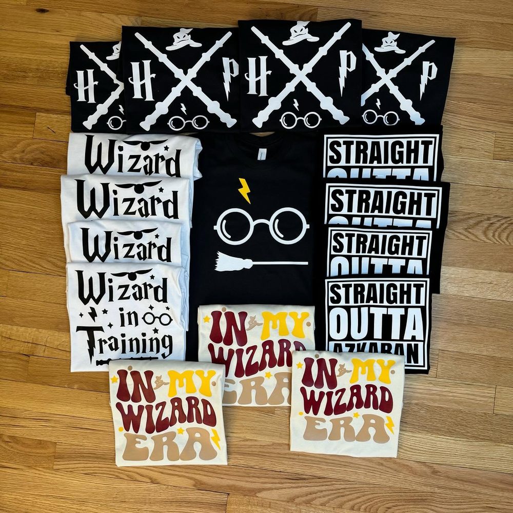 A big set of wizard-themed party shirts in black, white, and cream
