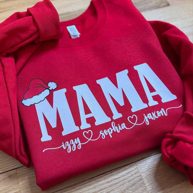 Red holiday “MAMA” sweatshirt with a Santa hat and the kids’ names in script